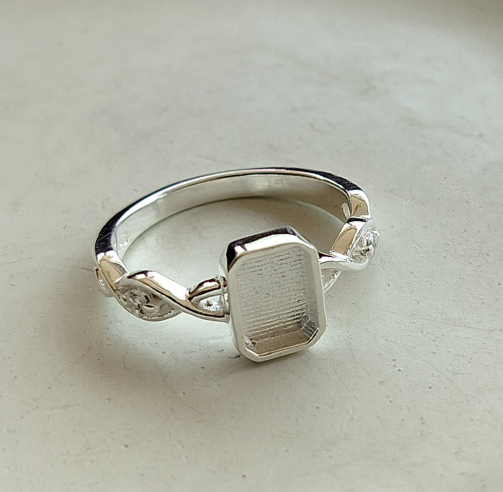 Emerald shape Twist Band Cubic Zirconia Accent Ring