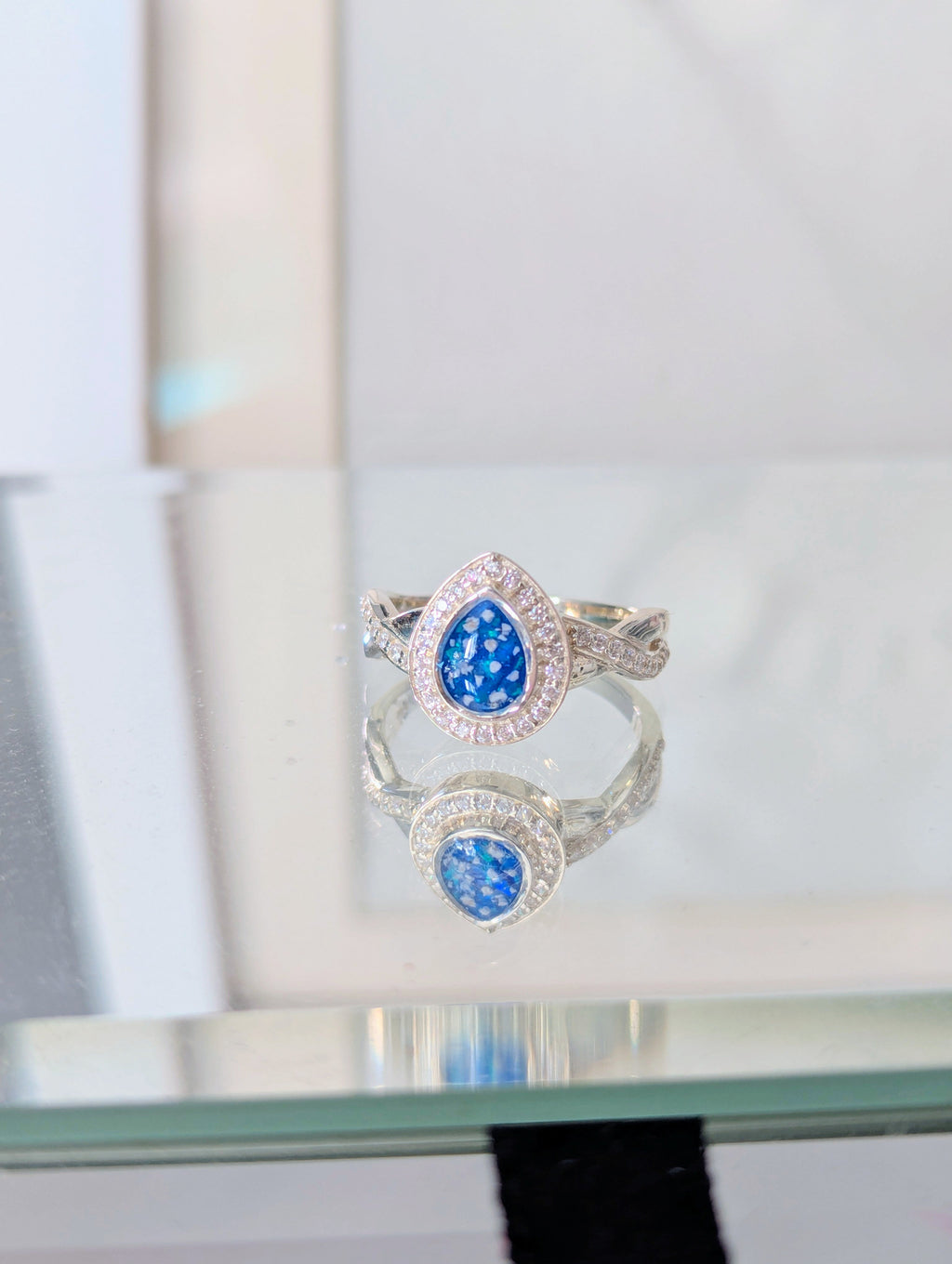 Cross Band Droplet Sparkle Cubic Zirconia Keepsake Ring